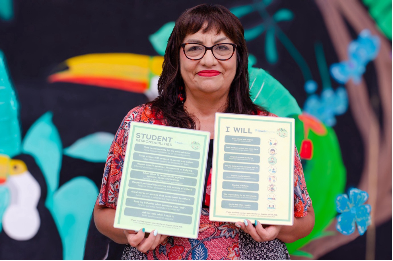 Silvia Carillo of ENLACE with posters